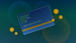 Tarjeta de crédito azul y monedas doradas como símbolos de cashback y recompensas